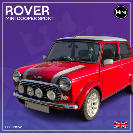 Red Mini Cooper Sport with silver stripes and four headlights against a purple background.